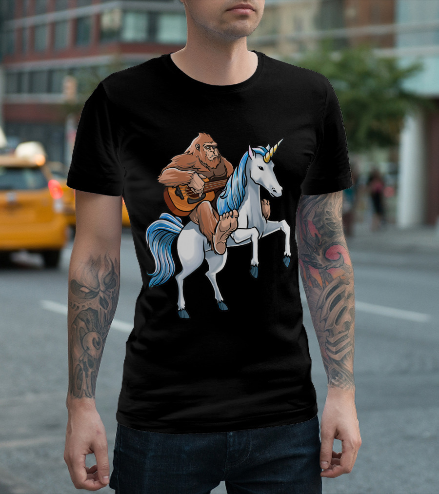 Bigfoot Playing Guitar Riding a Unicorn T-Shirt