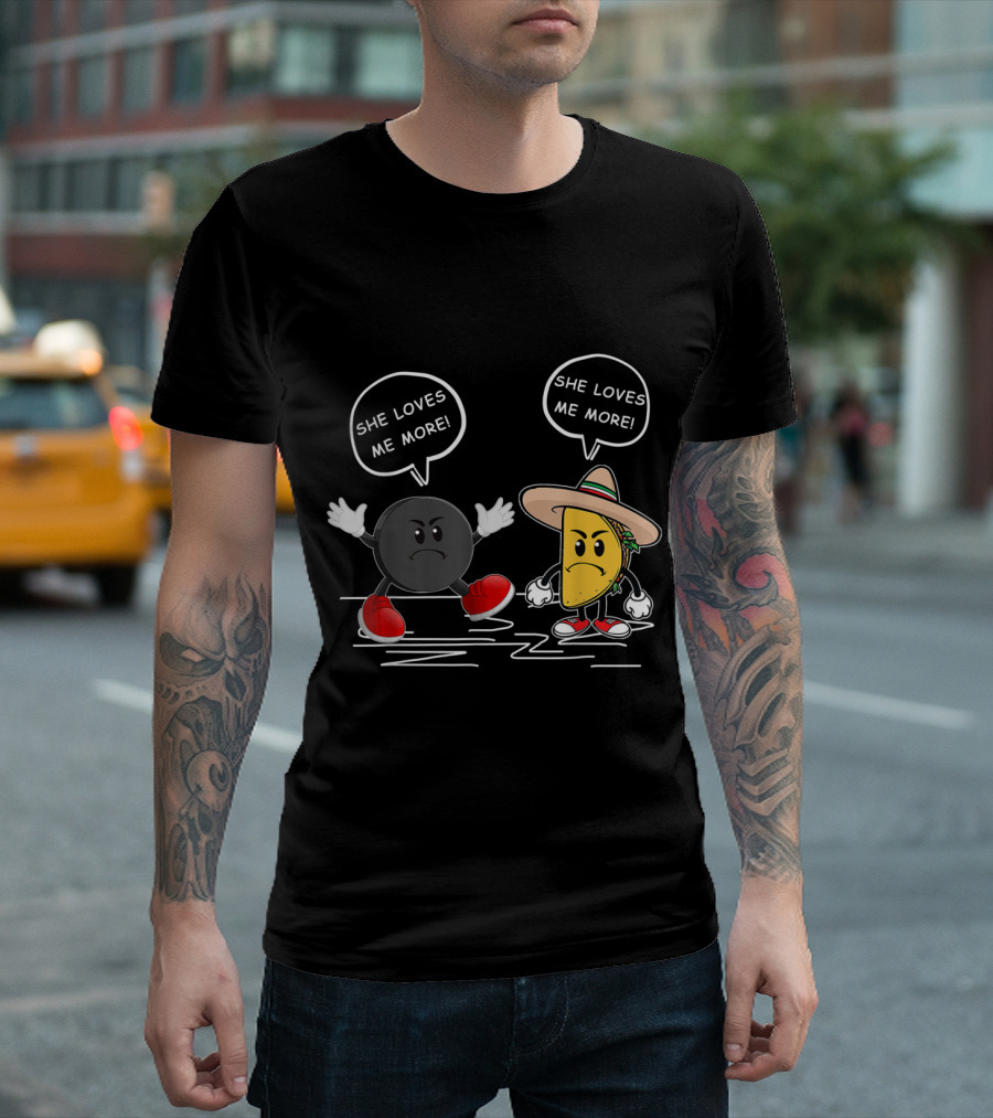 She Loves Me More: Playful Hockey Puck Versus Taco Showdown T-Shirt