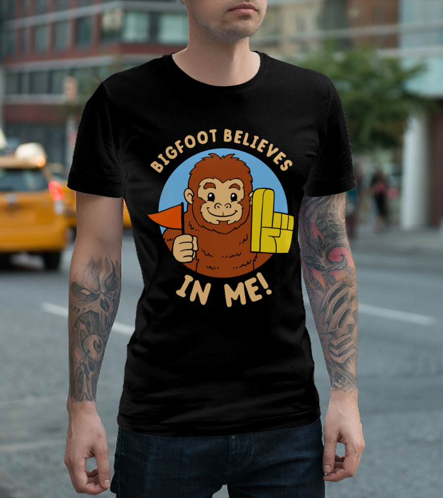 Bigfoot Believes In Me Cartoon Brown Sasquatch with Foam Finger and Red Flag T-Shirt