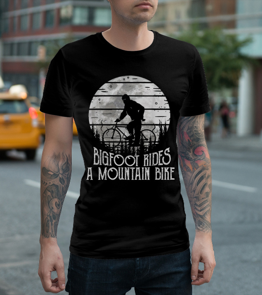 Bigfoot Rides A Mountain Bike Silhouette Against Moonlit Forest T-Shirt