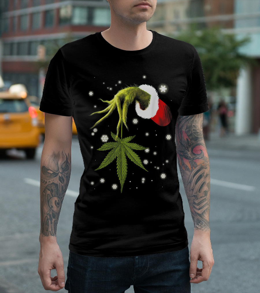 Grinch Hand Holding Cannabis Leaf with Santa Hat and Snowflakes T-Shirt