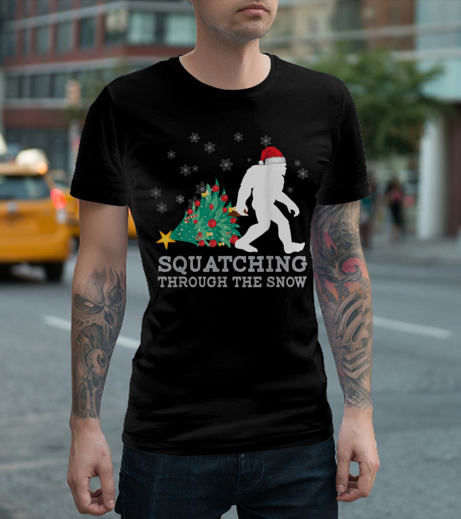 Bigfoot Squatching Through The Snow Santa Hat Christmas Tree Snowflakes T-Shirt