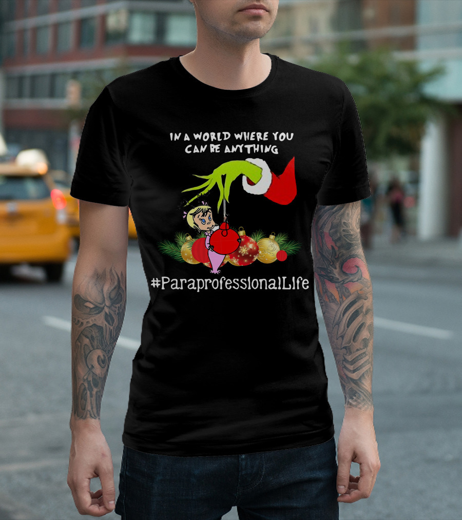 In A World Where You Can Be Anything Hand Grinch Holding Ornaments #ParaprofessionalLife T-Shirt