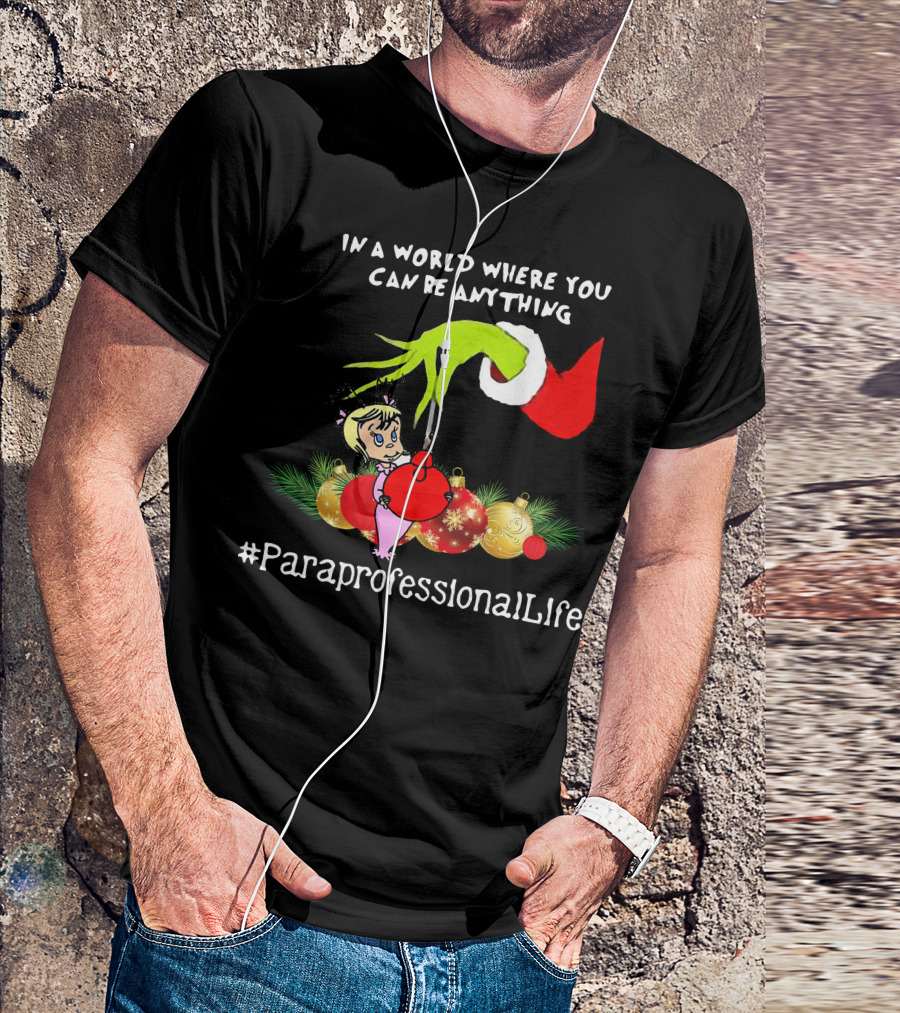 In A World Where You Can Be Anything Hand Grinch Holding Ornaments #ParaprofessionalLife T-Shirt