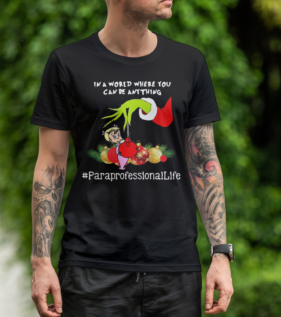 In A World Where You Can Be Anything Hand Grinch Holding Ornaments #ParaprofessionalLife T-Shirt