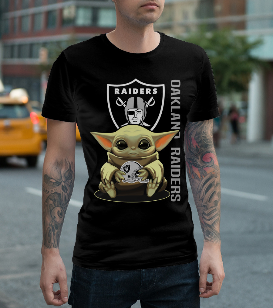 Baby Yoda Holding Oakland Raiders Helmet With Raiders Logo In Background T-Shirt