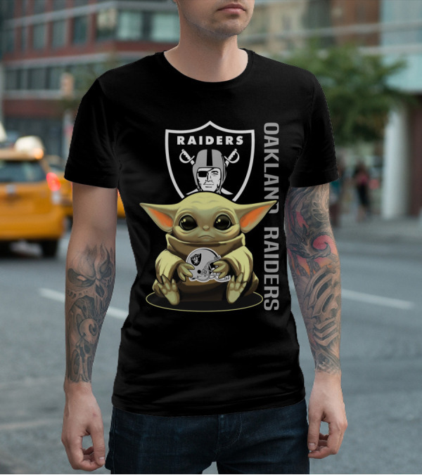 Baby Yoda Holding Oakland Raiders Helmet With Raiders Logo In Background T-Shirt