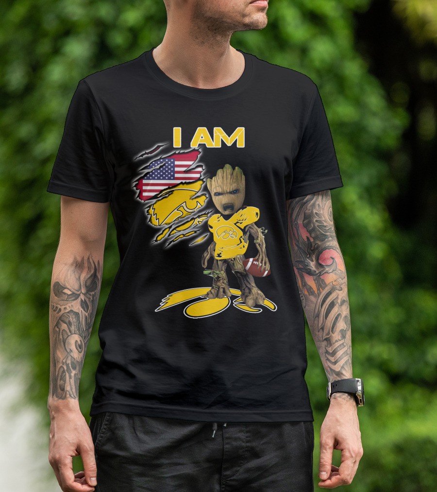 I Am Hawkeyes Baby Groot Holding Football With Usa Flag And Iowa Hawkeyes T-Shirt