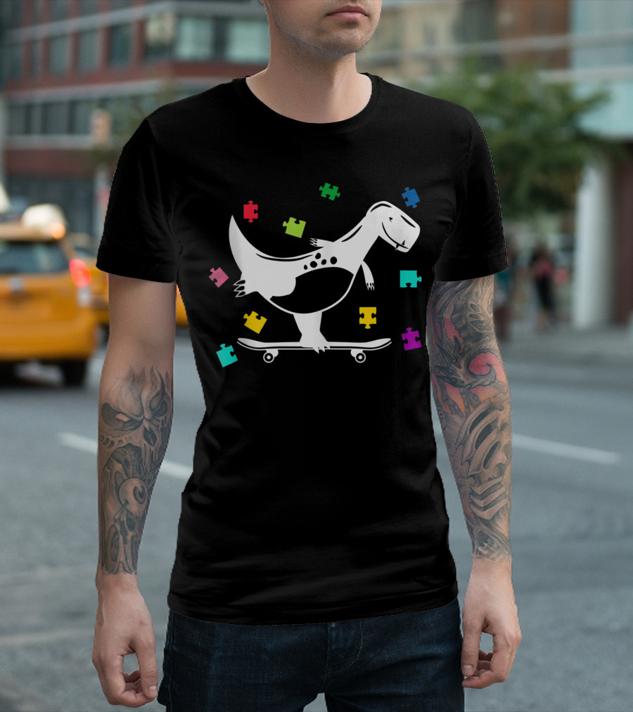 Autism Awareness Dinosaur Skateboarding with Colorful Puzzle Pieces T-Shirt