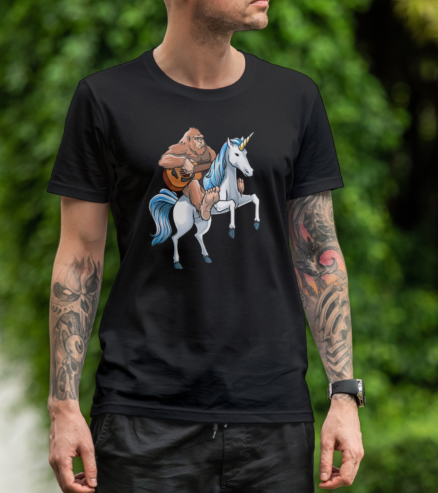 Bigfoot Playing Guitar While Riding Unicorn T-Shirt
