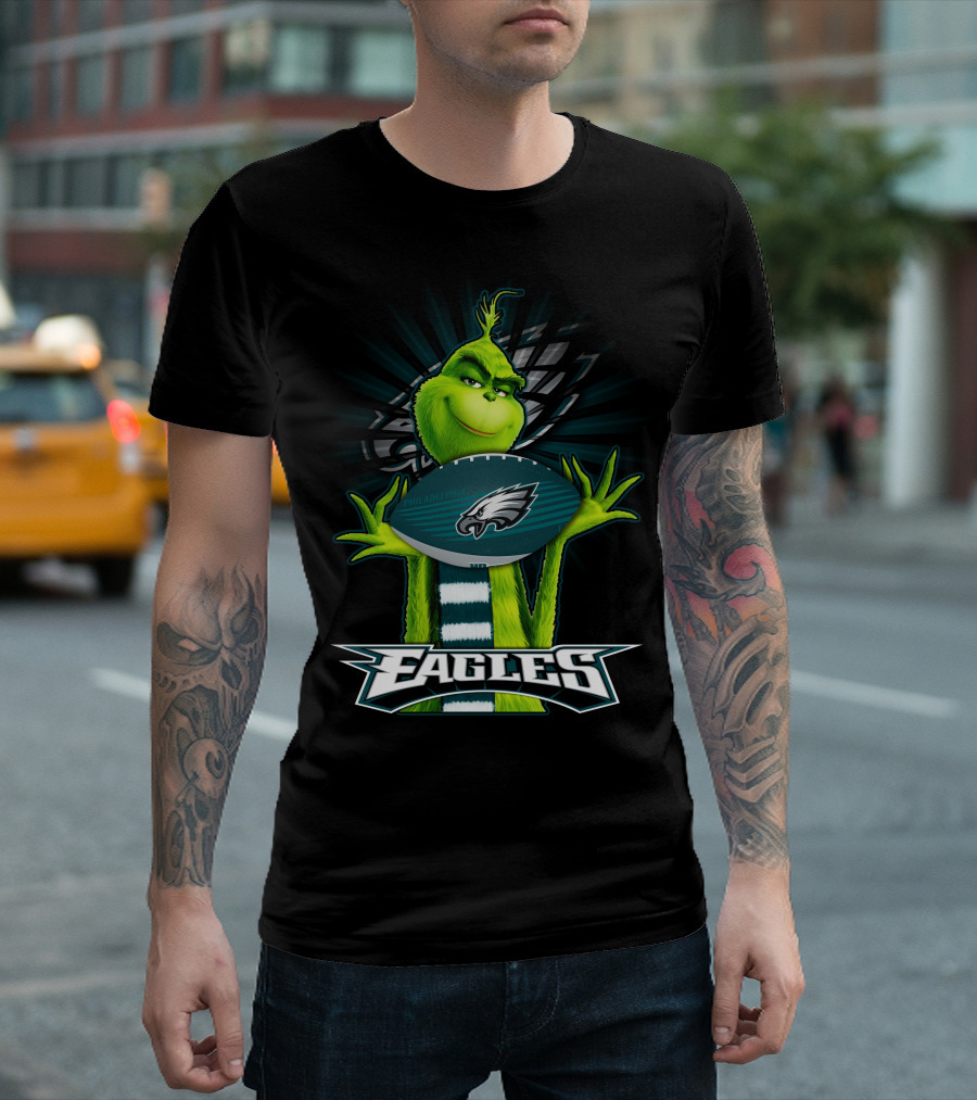 Grinch Holding Philadelphia Eagles Football with Team T-Shirt