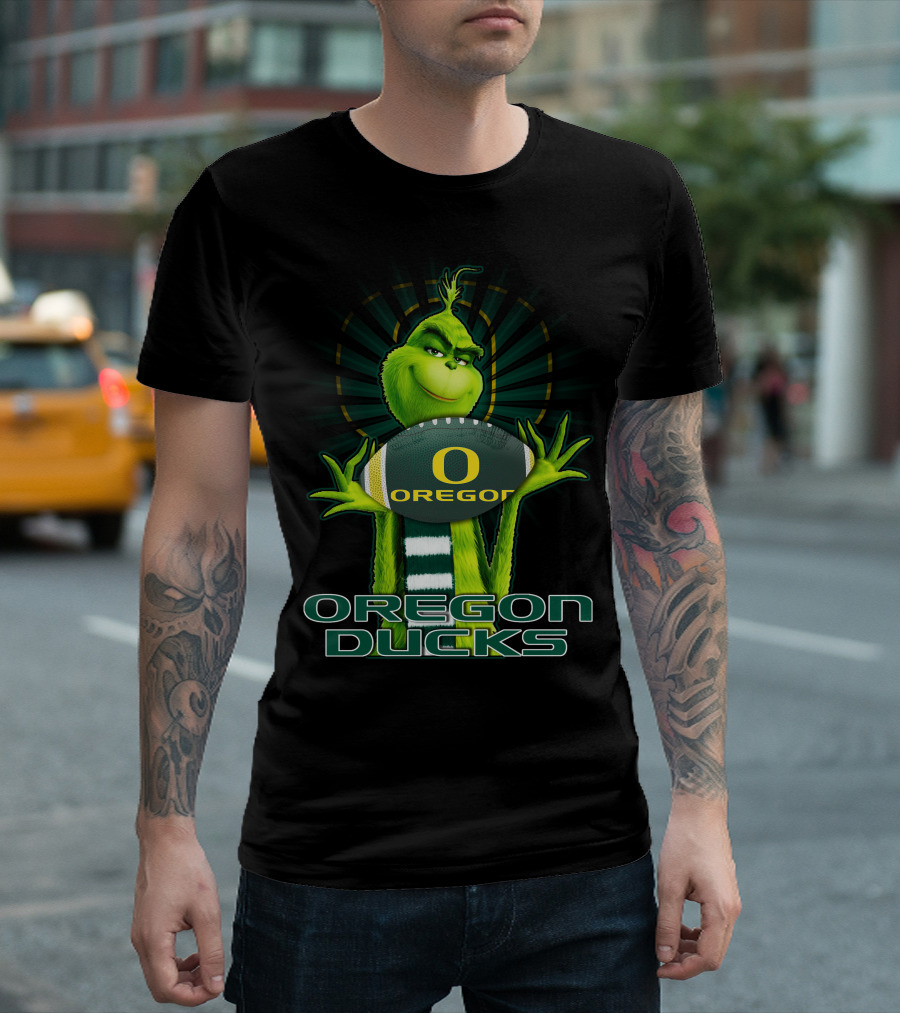 Grinch Holding Oregon Ducks Football T-Shirt