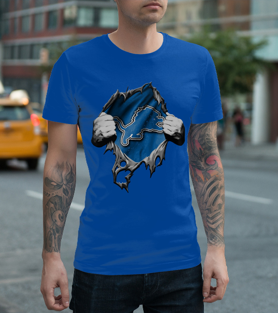 Torn Skin Revealing Detroit Lions Emblem On Blue T-Shirt