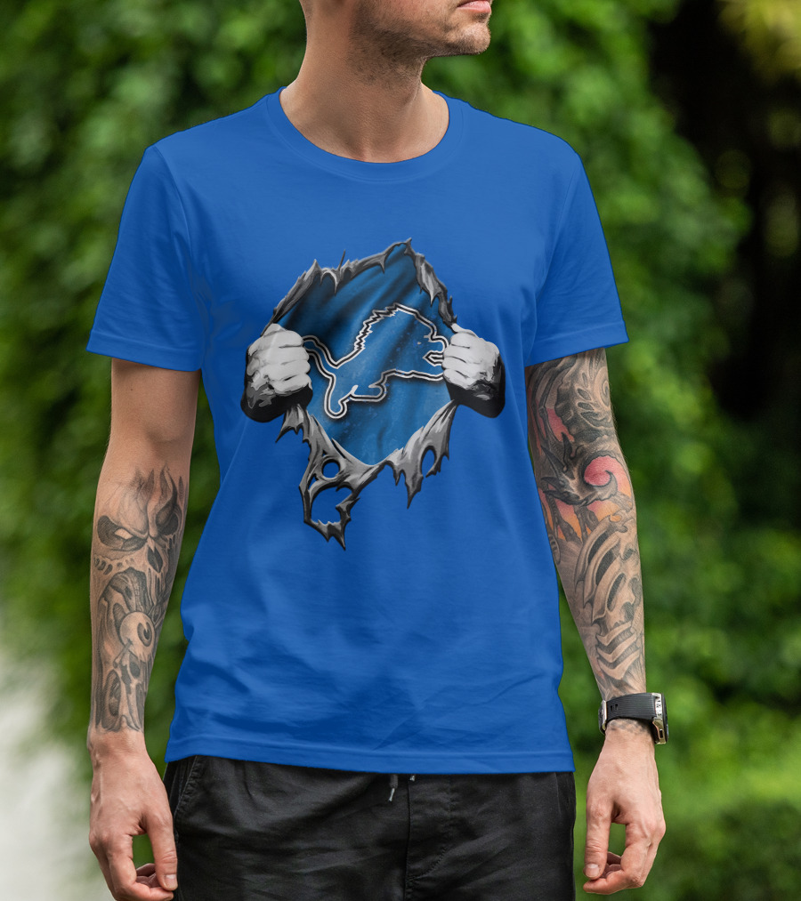 Torn Skin Revealing Detroit Lions Emblem On Blue T-Shirt