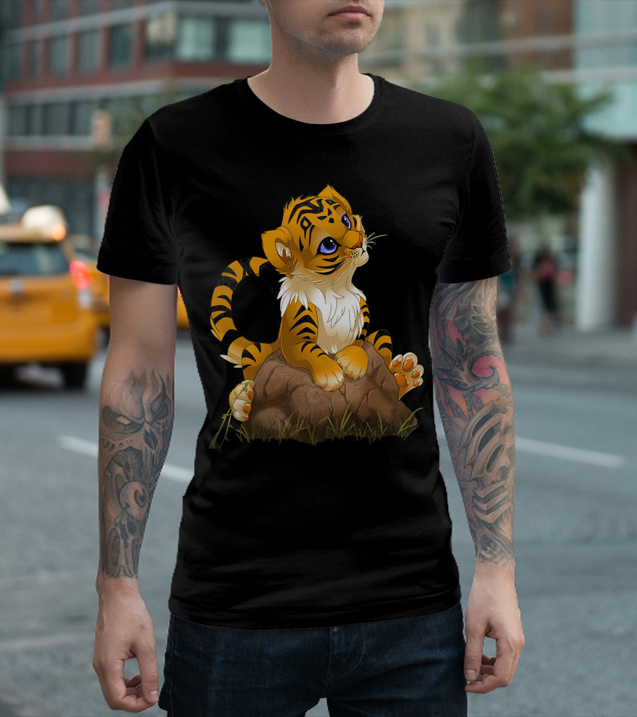 Cute Tiger Cub Playfully Sitting on Rock with Grass T-Shirt