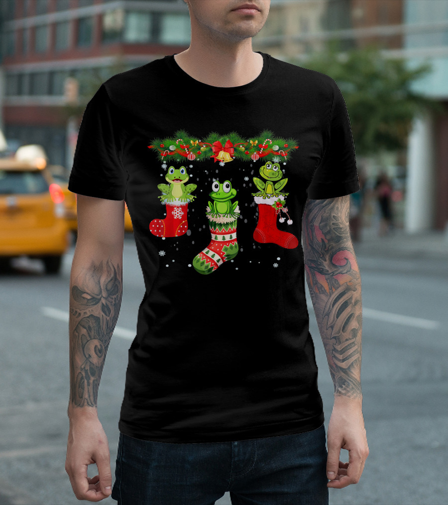 Three Frogs in Christmas Stockings Under Festive Garland with Santa Hat T-Shirt