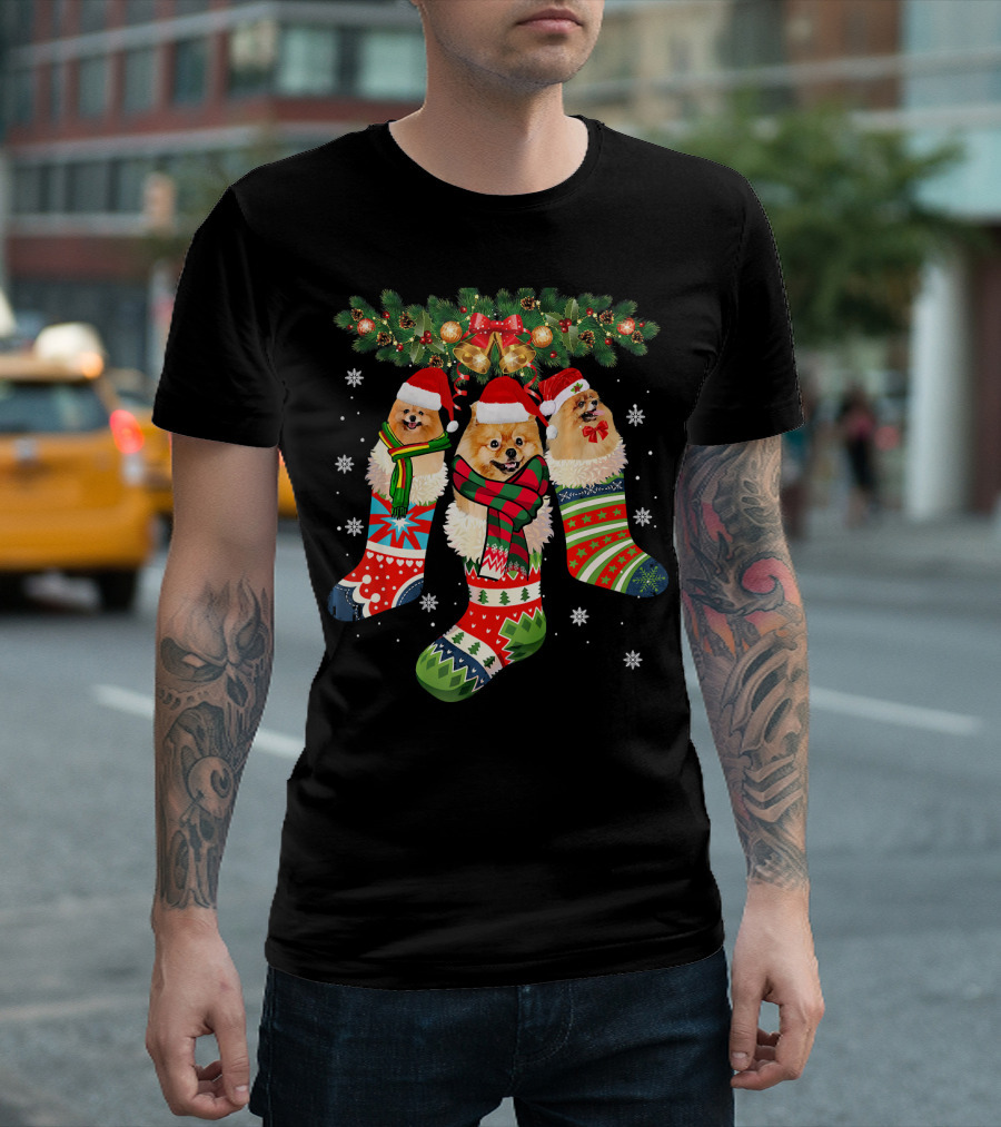 Three Pomeranian Dogs in Festive Christmas Stockings with Santa Hats and Winter Decorations T-Shirt