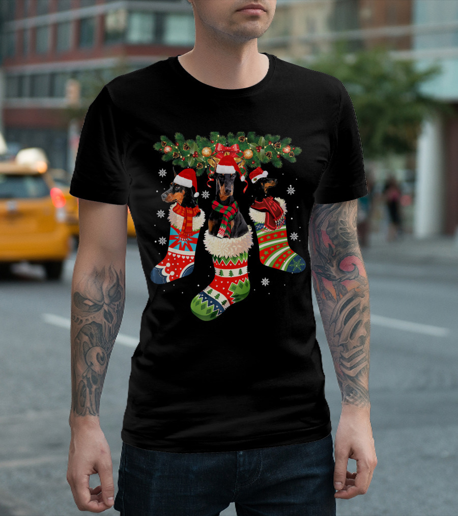 Three Doberman in Christmas Stockings with Santa Hats and Festive Decorations T-Shirt
