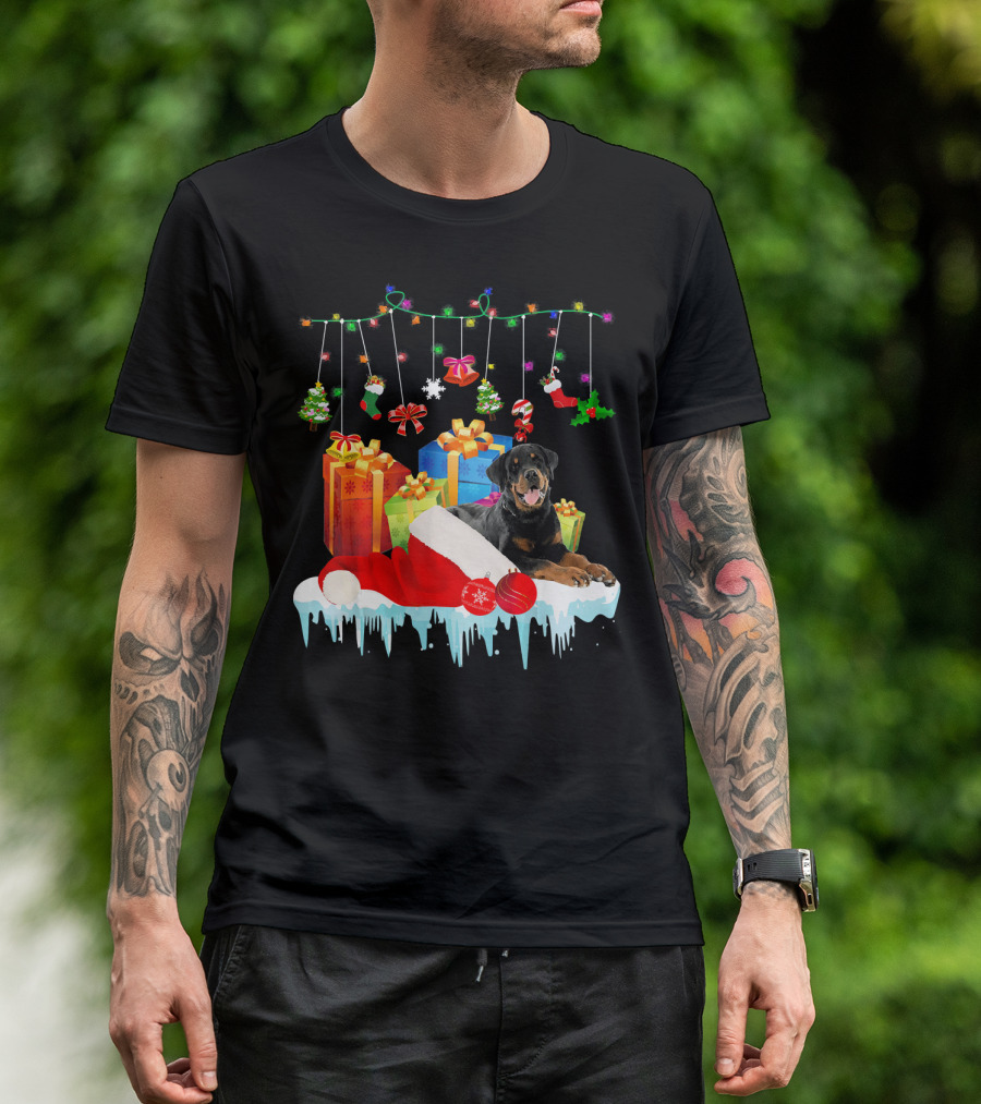 Rottweiler With Santa Hat And Christmas Gifts Under Holiday Lights T-Shirt
