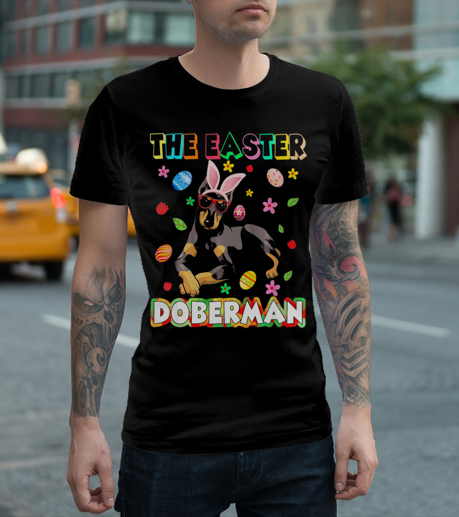 THE EASTER DOBERMAN Funny Dog wearing Bunny Ears and Sunglasses with Colorful Eggs and Flowers T-Shirt