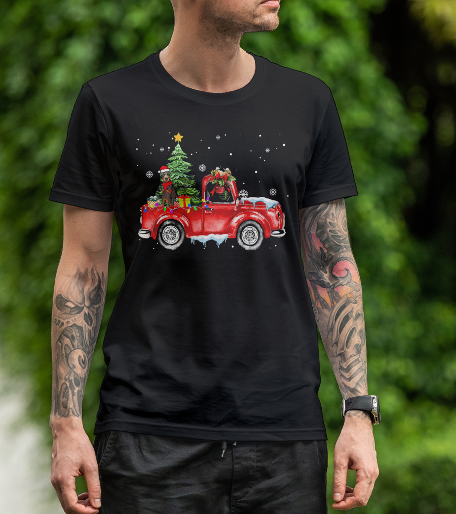 Doberman Dog Christmas Snow Scene In Festive Red Truck With Gifts And Christmas Tree T-Shirt