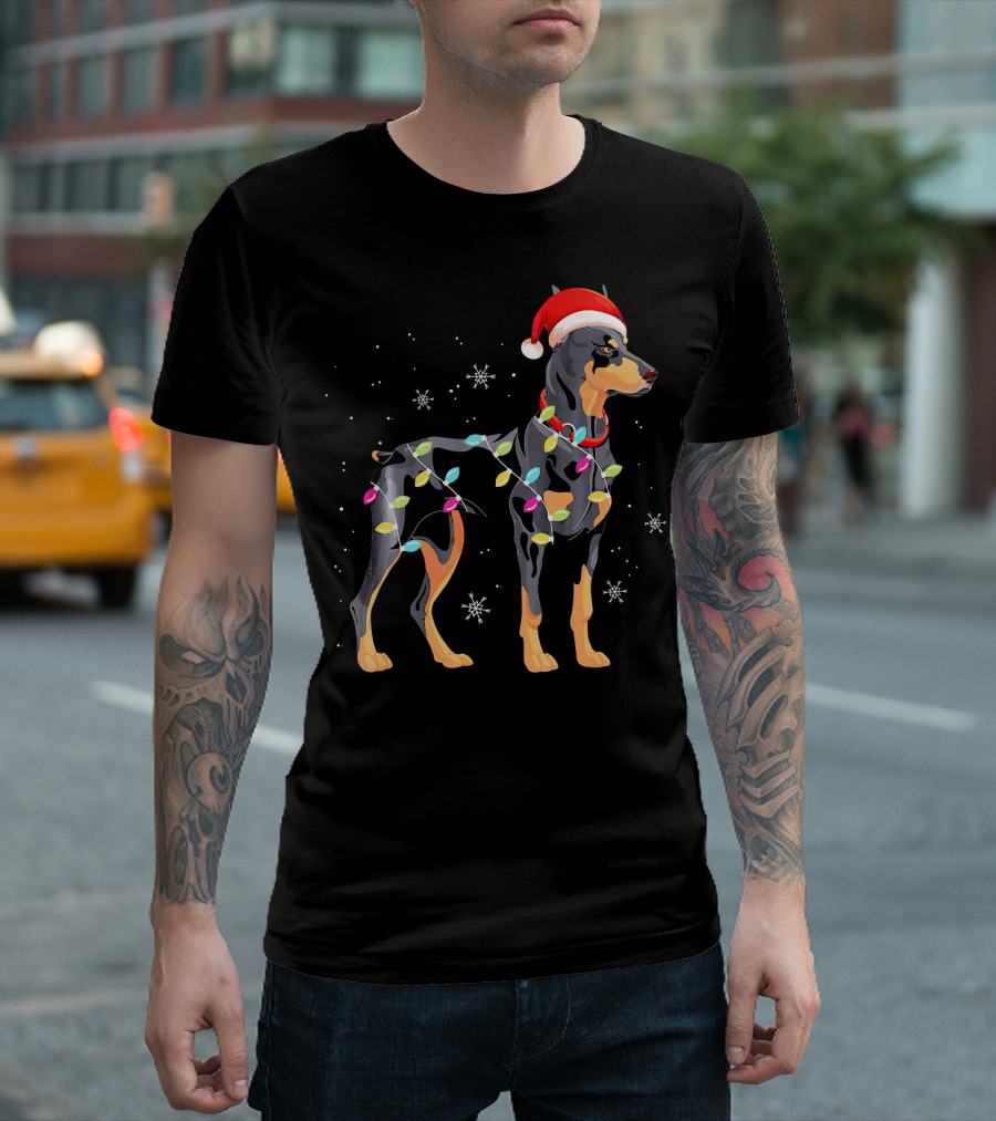 Doberman Wrapped in Christmas Lights with Santa Hat and Snowflakes T-Shirt