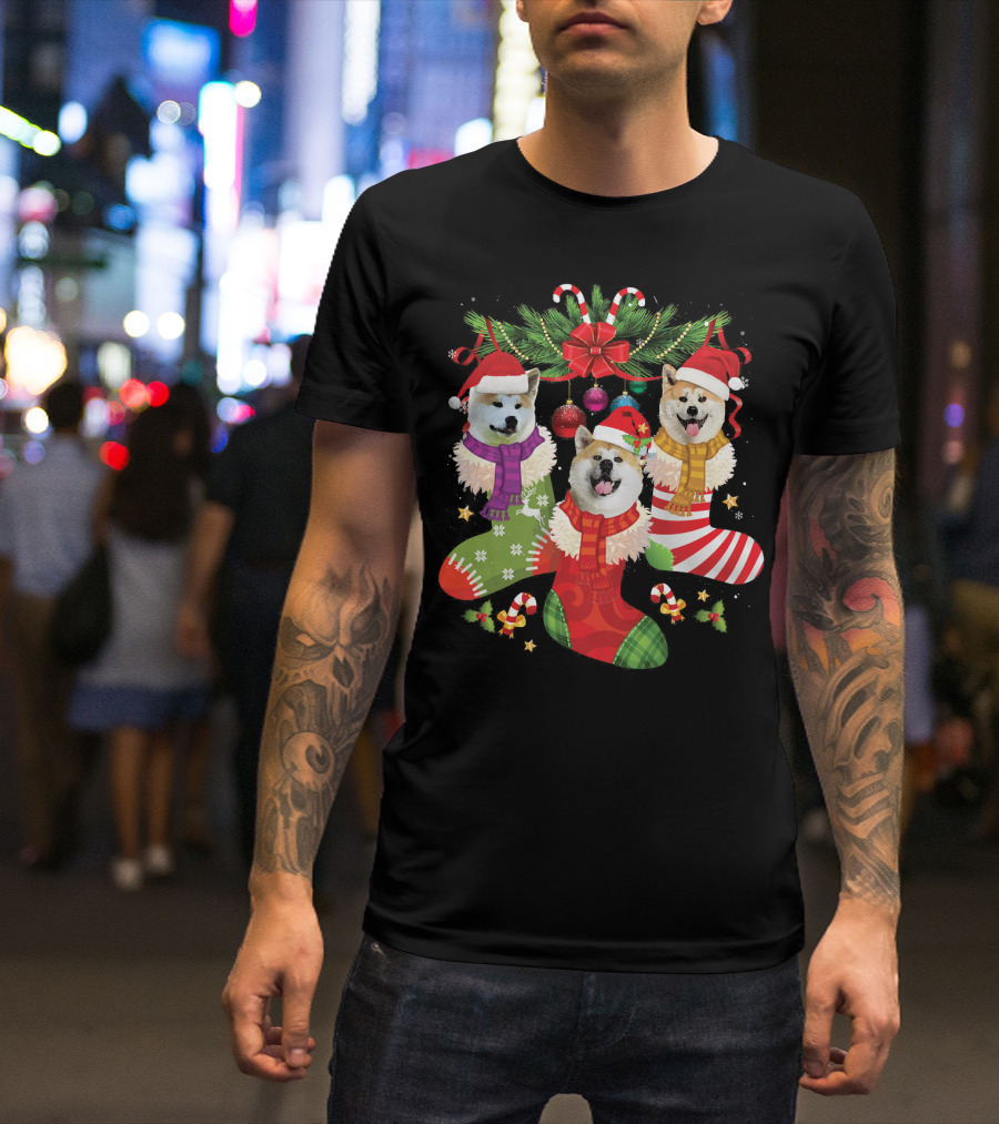 Three Akita Dog Puppies In Christmas Stockings With Santa Hats And Holiday Decorations T-Shirt