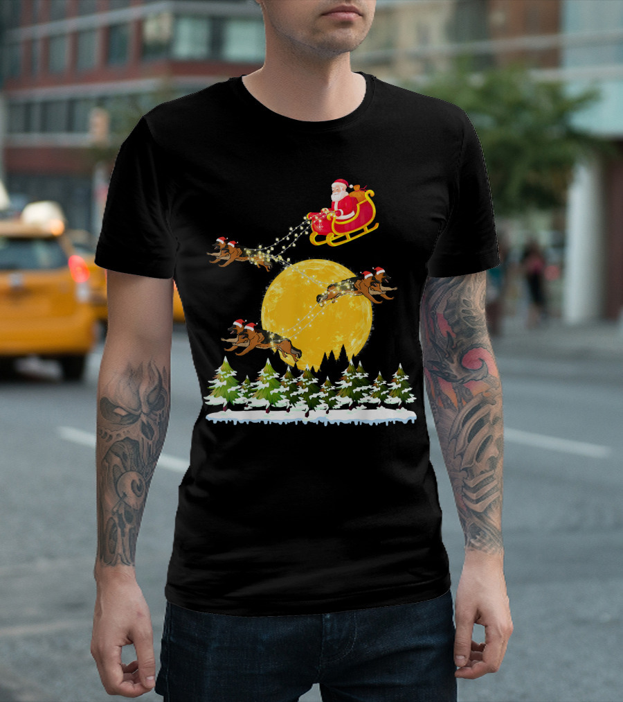 Santa Claus In Sled With German Shepherds Flying Over Moonlit Forest T-Shirt