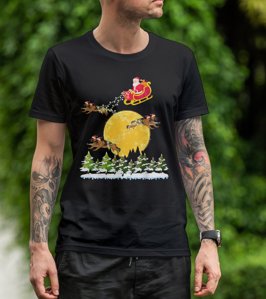 Santa Claus In Sled With German Shepherds Flying Over Moonlit Forest T-Shirt