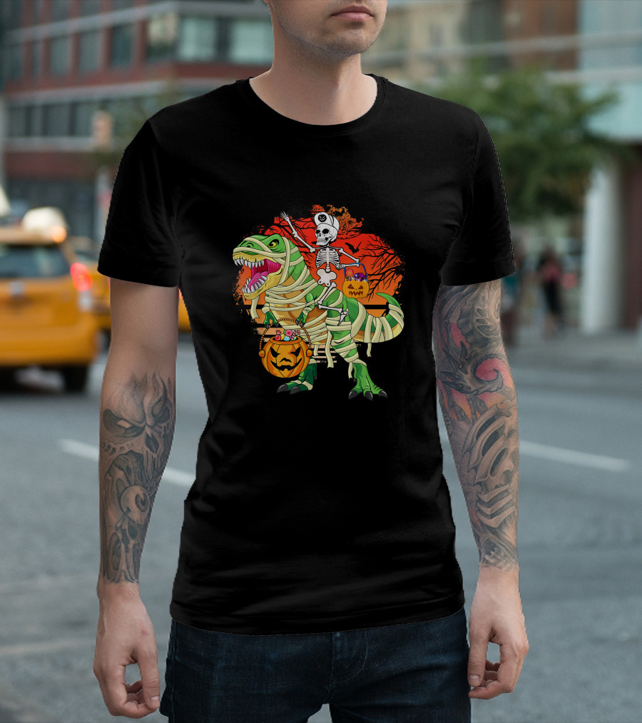 Skeleton Riding Mummy Dinosaur Rex with Halloween Pumpkins on Spooky Background T-Shirt