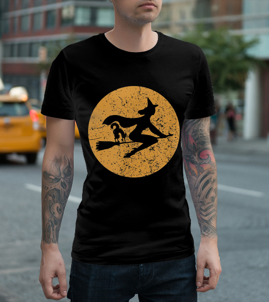 Witch on a Broomstick with Cat Silhouette Against Moon Background T-Shirt