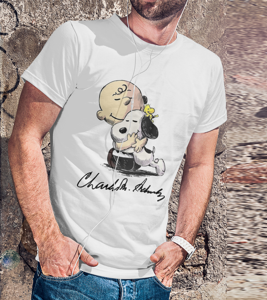 Snoopy And Charlie Brown Hugging By Charles M. Schulz T-Shirt