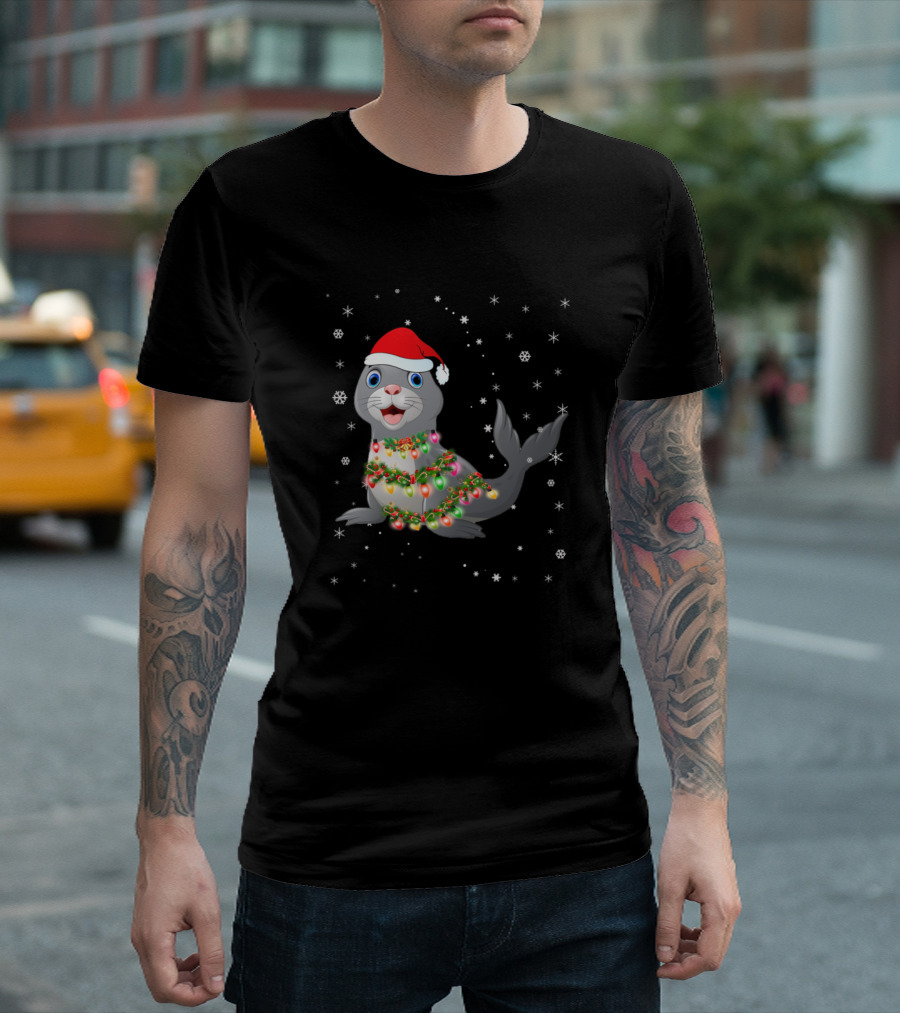 Festive Seal Wrapped in Christmas Lights and Santa Hat Amidst Snowflakes T-Shirt
