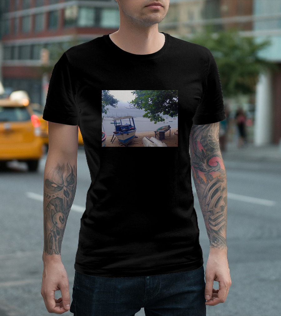 Boats Stopped At The Beach Under Rainy Gray Skies And Lush Green Trees T-Shirt