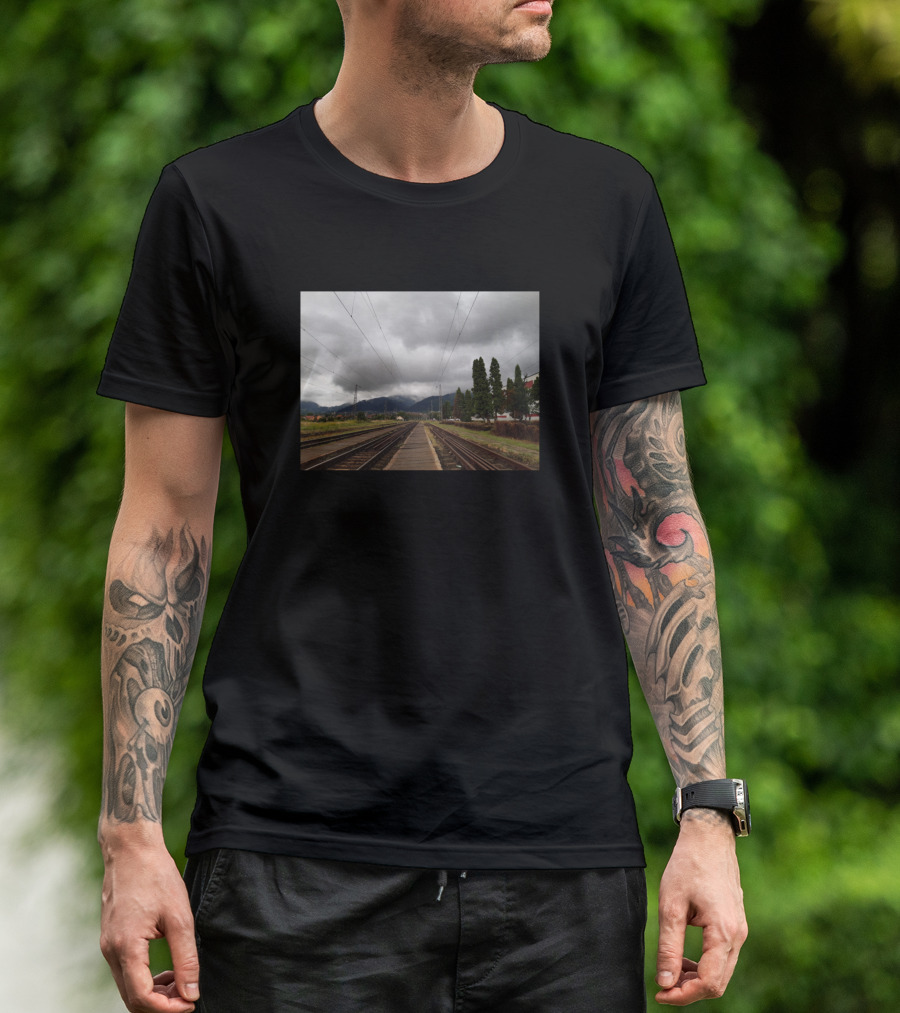 View Of Draculas House Train Tracks Under Cloudy Sky T-Shirt