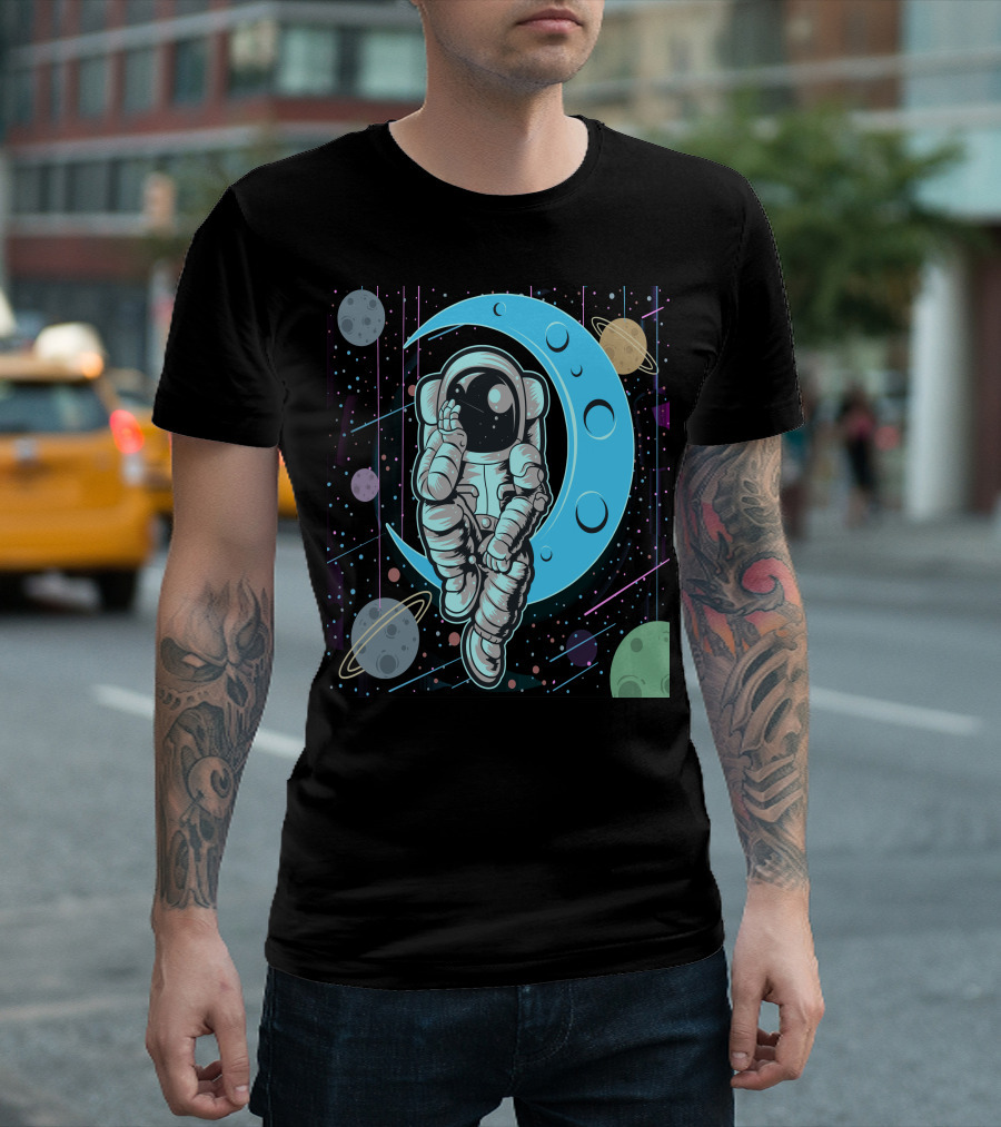 Thoughtful Astronaut on Crescent Moon with Colorful Planets T-Shirt