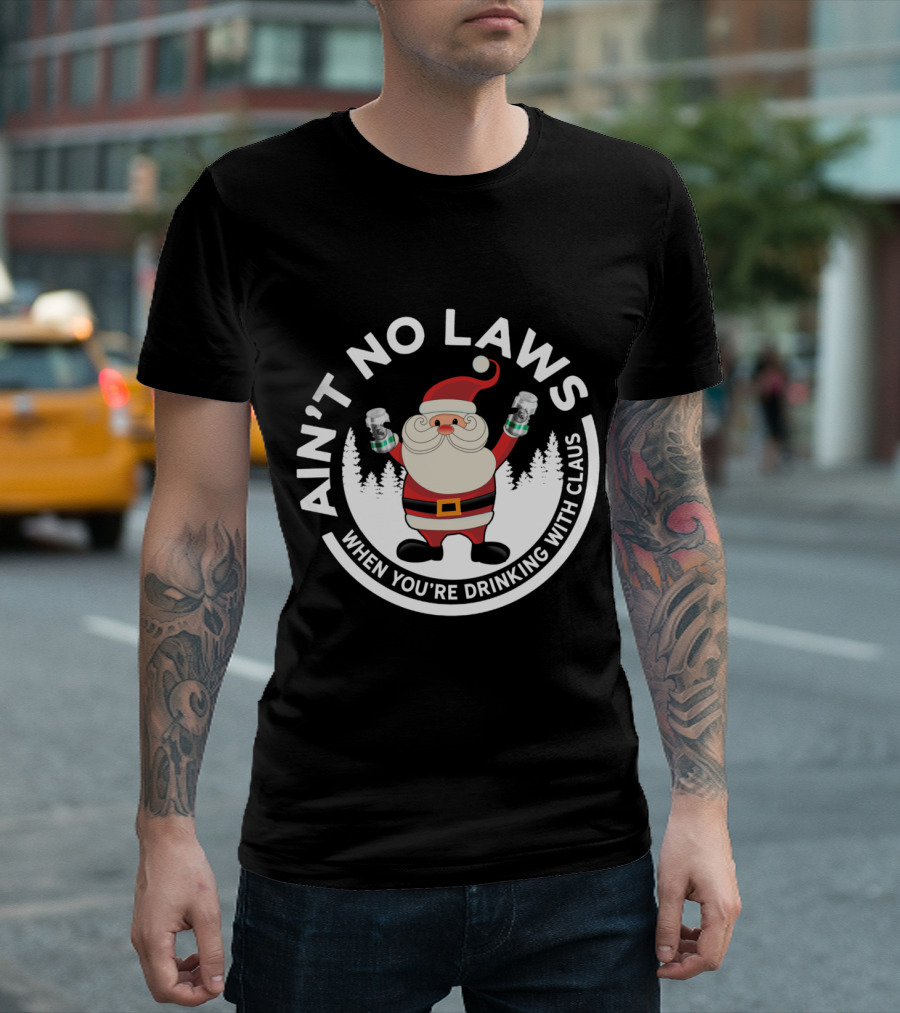 AIN'T NO LAWS WHEN YOU'RE DRINKING WITH CLAUS SANTA HOLDING CANS IN FRONT OF TREES T-Shirt