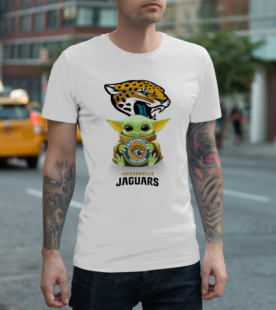 Grogu Holding Jacksonville Jaguars Badge with Mascot in Background T-Shirt