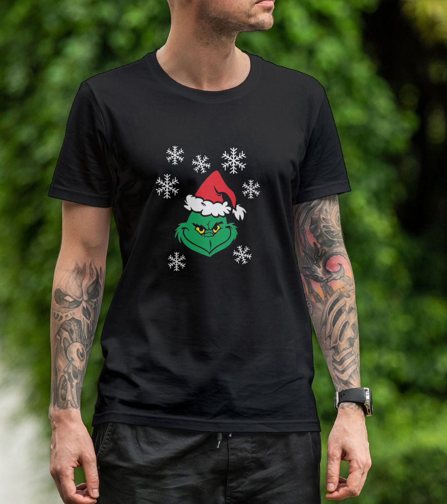 Grinch Face With Santa Hat Surrounded By Snowflakes Iconic Holiday Character T-Shirt