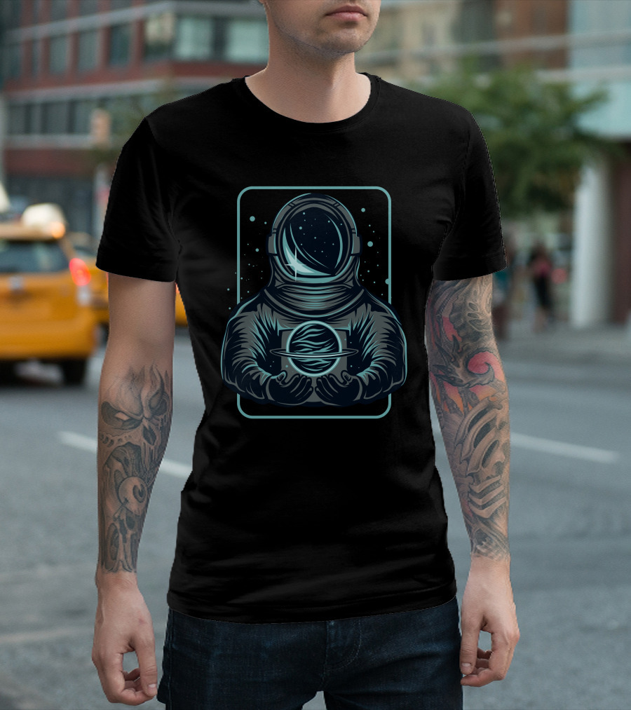 Astronaut Holding A Saturn-Like Planet In Space-Themed T-Shirt