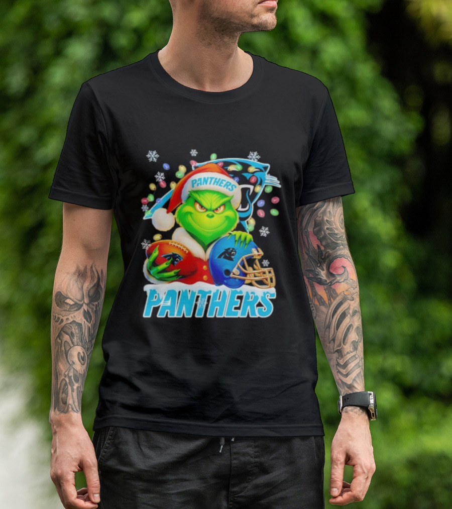 Grinch Santa Hat Holding Carolina Panthers Football And Helmet Merry Christmas T-Shirt