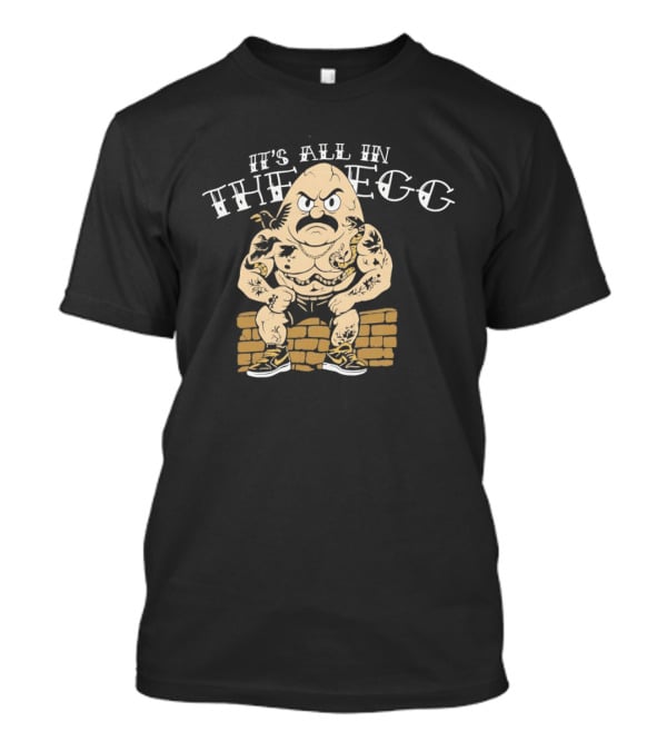 It's All In The Egg Muscular Cartoon Character With Mustache Sitting On Brick Wall T-Shirt