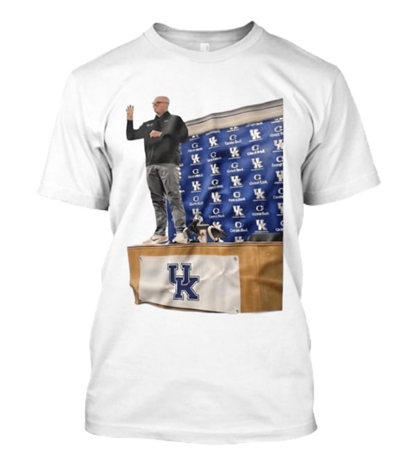 UK Volleyball Coach Craig Skinner Standing On Table With UK Logo And Awards T-Shirt