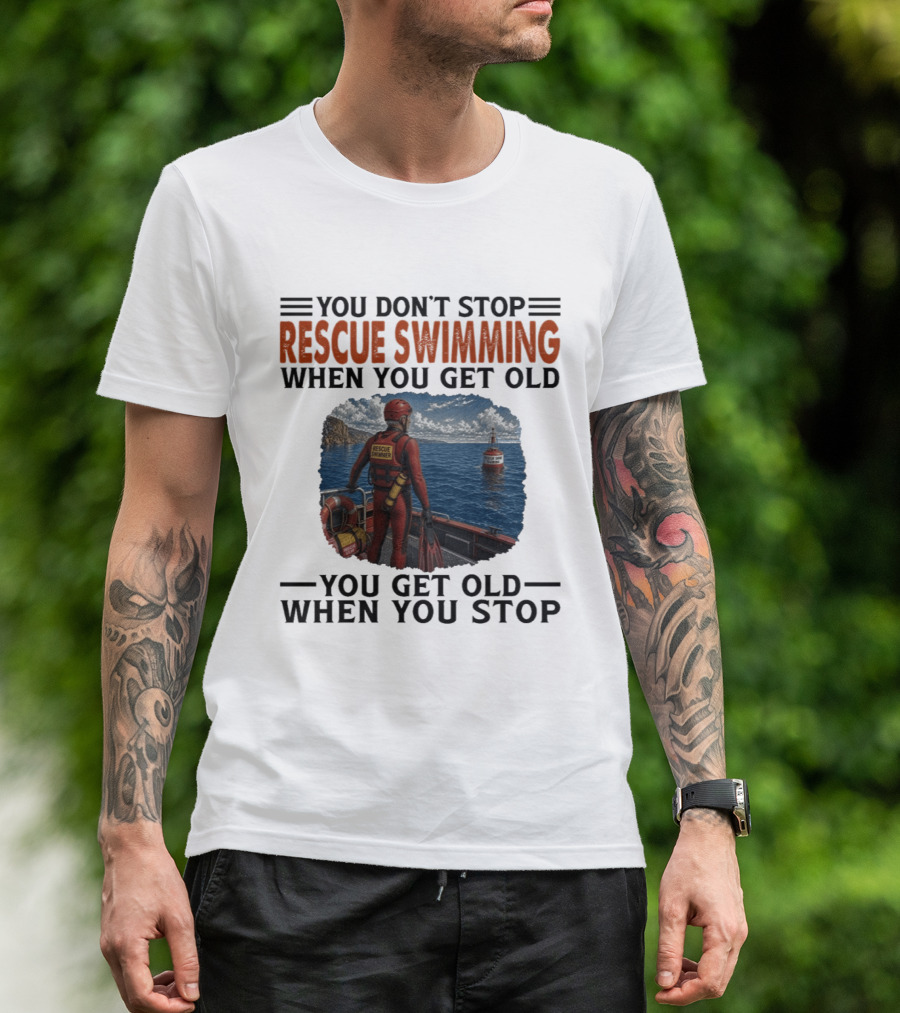 You Don't Stop Rescue Swimming When You Get Old You Get Old When You Stop Rescue Swimmer Standing On Boat Near Lighthouse T-Shirt