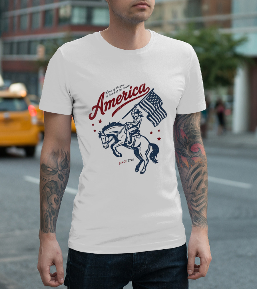 America Land Of The Free Home Of The Brave Since 1776 Cowboy Holding Flag Patriotic T-Shirt