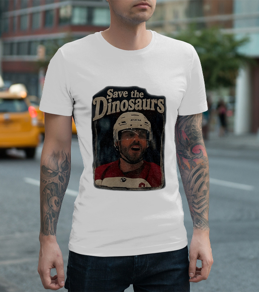 Connor Storrie Wearing Scott Hunter Save The Dinosaurs CCM Hockey T-Shirt