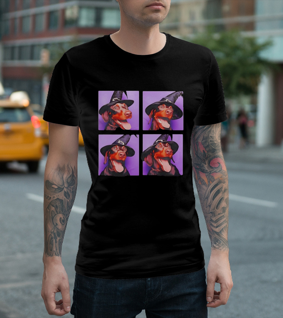 Doberman Pinscher In Witch Hat For Halloween With Purple T-Shirt