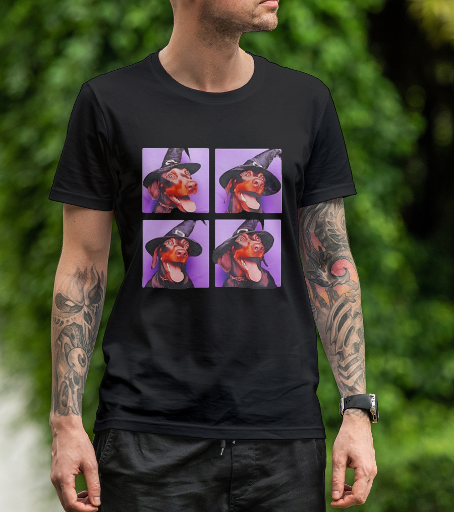 Doberman Pinscher In Witch Hat For Halloween With Purple T-Shirt