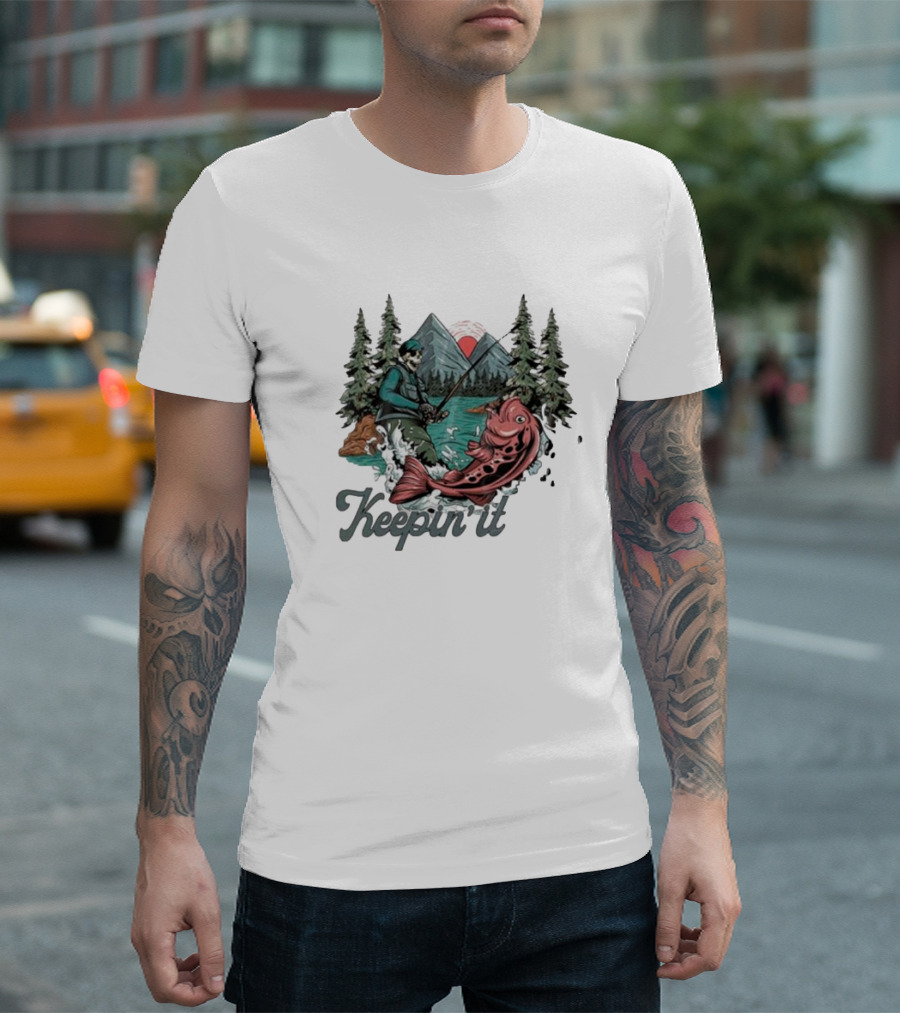 Keepin' It Reel Skeleton Fishing Adventure with Giant Fish and Mountain Lake Scene T-Shirt
