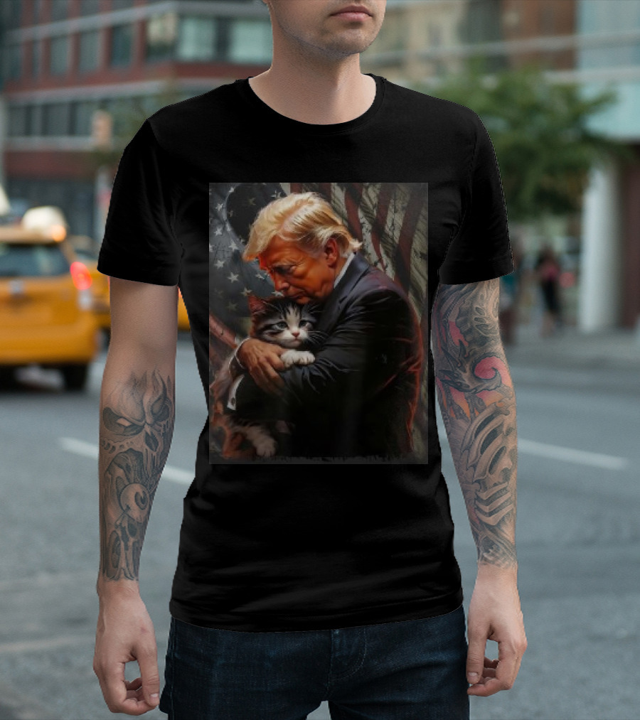 Trump Hugging An Orange Cat 2024 Make Cats Safe Again American Flag Background T-Shirt